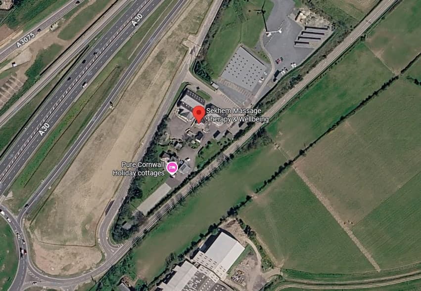 Satellite view of Trevissome Park beside the A30, with a pin on the venue